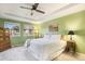 Serene main bedroom features a tray ceiling, carpeted floors, and ample natural light at 10247 Telluride Way, Commerce City, CO 80022