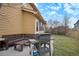 Backyard patio with built-in bench and gas grill at 10247 Telluride Way, Commerce City, CO 80022