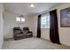 Cozy theater bedroom with comfortable seating, a large window, and a movie poster for a relaxing experience at 1048 Larkspur Dr, Erie, CO 80516