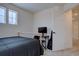 Bedroom with view to a desk with a computer, and an open white door at 1048 Larkspur Dr, Erie, CO 80516