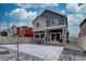 A stylish exterior with a welcoming backyard featuring modern design, with lots of sunlight at 1048 Larkspur Dr, Erie, CO 80516
