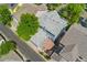 Birds eye view showcases a well maintained home, brick patio, and surrounding neighborhood at 7860 E Ellsworth Ave, Denver, CO 80230