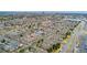 Stunning aerial view of a home in a neighborhood with mature trees at 7860 E Ellsworth Ave, Denver, CO 80230