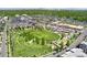 Enjoy this community's aerial view featuring a green park, playground, and modern homes in a vibrant neighborhood at 7860 E Ellsworth Ave, Denver, CO 80230
