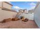 Cozy brick backyard patio with mature trees, garden beds, and a grill, perfect for outdoor entertaining at 7860 E Ellsworth Ave, Denver, CO 80230