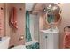 Bathroom features a modern vanity and shower with decorative curtain at 7860 E Ellsworth Ave, Denver, CO 80230