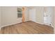 Cozy bedroom featuring hardwood floors, a window, and a closet at 7860 E Ellsworth Ave, Denver, CO 80230