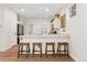 Bright kitchen features a breakfast bar with seating and stainless steel appliances at 7860 E Ellsworth Ave, Denver, CO 80230