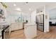 Bright kitchen with white cabinetry, stainless steel appliances, and a center island at 7860 E Ellsworth Ave, Denver, CO 80230