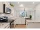 Well-lit kitchen with stainless steel appliances and granite countertops at 7860 E Ellsworth Ave, Denver, CO 80230