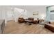 Spacious living room with hardwood floors and ample seating at 7860 E Ellsworth Ave, Denver, CO 80230