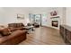 Inviting living room with a modern fireplace and hardwood floors at 7860 E Ellsworth Ave, Denver, CO 80230