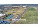 Aerial view of the Lowry Sports Complex Park with tennis courts, playing fields, and parking at 7860 E Ellsworth Ave, Denver, CO 80230