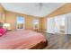 Spacious main bedroom with vaulted ceiling, hardwood floors, and natural light at 7860 E Ellsworth Ave, Denver, CO 80230