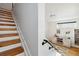 Bright entryway showcasing hardwood steps, a modern staircase, and stylish decor, leading to the upper levels at 2540 N Clay St, Denver, CO 80211