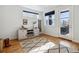 Inviting living area with hardwood flooring, natural light, stylish furnishings, and a decorative area rug at 2540 N Clay St, Denver, CO 80211