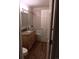 Renovated bathroom with modern vanity, granite countertop, and tiled shower/tub combo at 12640 W Virginia Ave, Lakewood, CO 80228