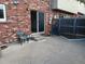 Private concrete patio with mature landscaping offers a quiet outdoor space at 12640 W Virginia Ave, Lakewood, CO 80228
