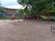 Community playground with swings, slides, and climbing area at 12640 W Virginia Ave, Lakewood, CO 80228