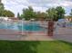 Community pool with lounge seating and shade umbrellas at 12640 W Virginia Ave, Lakewood, CO 80228