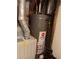 Close up of a water heater and furnace unit located inside the home at 12640 W Virginia Ave, Lakewood, CO 80228