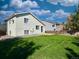 House backyard with grassy area and patio at 470 Grey Swallow St, Brighton, CO 80601