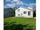 House backyard with grassy area and patio at 470 Grey Swallow St, Brighton, CO 80601