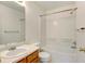 Clean bathroom with shower/tub combo and wood vanity at 470 Grey Swallow St, Brighton, CO 80601