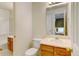 Clean bathroom with single vanity, toilet, and tub/shower combo at 470 Grey Swallow St, Brighton, CO 80601