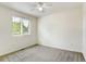 Spacious bedroom with ceiling fan and large window at 470 Grey Swallow St, Brighton, CO 80601