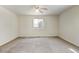 Spacious bedroom with ceiling fan and neutral carpeting at 470 Grey Swallow St, Brighton, CO 80601
