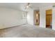 Bright bedroom featuring a walk-in closet and bathroom access at 470 Grey Swallow St, Brighton, CO 80601