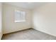 Well-lit bedroom with window and neutral carpeting at 470 Grey Swallow St, Brighton, CO 80601