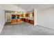 Eat-in kitchen featuring wood cabinets, an island, and a breakfast bar at 470 Grey Swallow St, Brighton, CO 80601