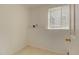Basement laundry room with window and tile flooring at 470 Grey Swallow St, Brighton, CO 80601