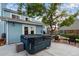 Backyard with a hot tub on a concrete patio, lounge chairs, and a shade tree offering a relaxing outdoor space at 11551 W 103Rd Dr, Broomfield, CO 80021