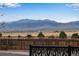 Expansive backyard view showcasing open space and mountain views in the distance at 11551 W 103Rd Dr, Broomfield, CO 80021