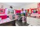 Whimsical bedroom with creative décor, featuring pink accents, posters, and a unique display of personal items at 11551 W 103Rd Dr, Broomfield, CO 80021