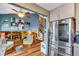 Cozy living space with fireplace open to kitchen and stairs to upper level at 11551 W 103Rd Dr, Broomfield, CO 80021