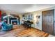 Cozy living room with a fireplace, piano, and comfortable seating at 11551 W 103Rd Dr, Broomfield, CO 80021