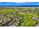 Aerial view highlighting community amenities: pool, soccer field, walking trails and lush green landscape at 854 Countrybriar Ln, Highlands Ranch, CO 80129