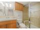 Bathroom featuring vanity with granite countertops, shower with glass door, and tile throughout at 854 Countrybriar Ln, Highlands Ranch, CO 80129