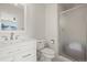 This bathroom features a white vanity, patterned floors, and a glass-enclosed shower at 854 Countrybriar Ln, Highlands Ranch, CO 80129
