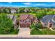 Charming two-story home with a well-manicured lawn and beautiful landscaping in a desirable neighborhood at 854 Countrybriar Ln, Highlands Ranch, CO 80129