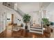 Bright foyer with dark hardwood floors, decorative plants, and a staircase with a stylish railing at 854 Countrybriar Ln, Highlands Ranch, CO 80129
