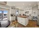 Bright kitchen with white cabinets, a wooden island, stainless steel appliances, and a tile floor at 854 Countrybriar Ln, Highlands Ranch, CO 80129