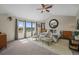 Spacious main bedroom with a large window, cozy seating area, and ample natural light at 854 Countrybriar Ln, Highlands Ranch, CO 80129