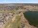 An aerial view shows the property is nestled near a lake, golf course, and athletic fields at 2730 River View Dr, Broomfield, CO 80023