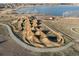 Aerial view of a bike park with dirt ramps and trails, offering outdoor recreational opportunities at 2730 River View Dr, Broomfield, CO 80023