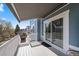 Inviting covered balcony featuring a retractable awning, ideal for outdoor relaxation and enjoying the surrounding views at 2730 River View Dr, Broomfield, CO 80023